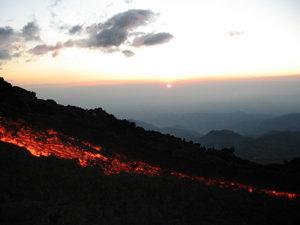 Sun setting and lava