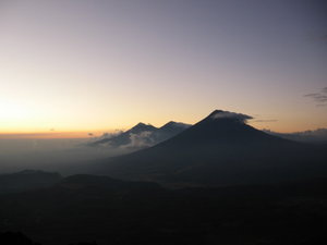 Sun setting behind the volcanoes