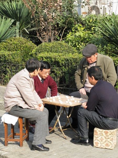 Old men playing board game
