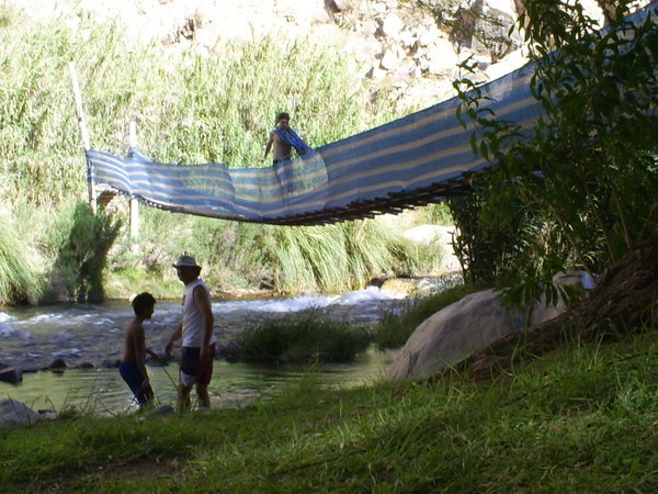Seba and uncle Juan by the river... - Seba y tio Juan al lado del rio....