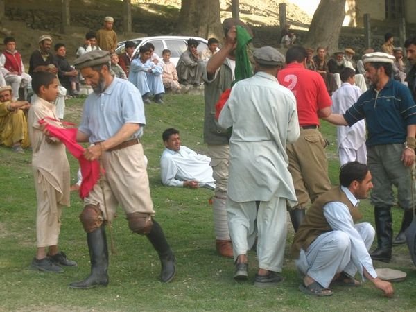 Men preparing for a polo match in Chitral