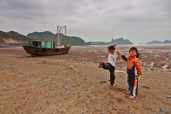 Some local children by their boat