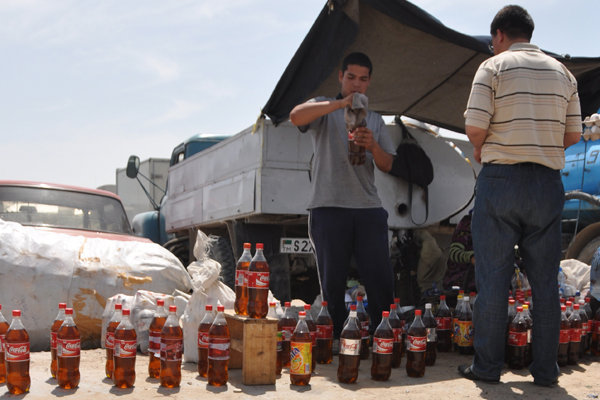 Selling Petrol from Coke Bottles - Tolkuchka Bazaar