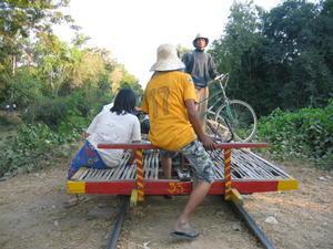 Locals riding the bamboo train transport many interesting things