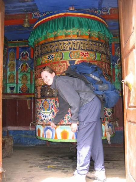 Amy turning a Tibetan prayer wheel