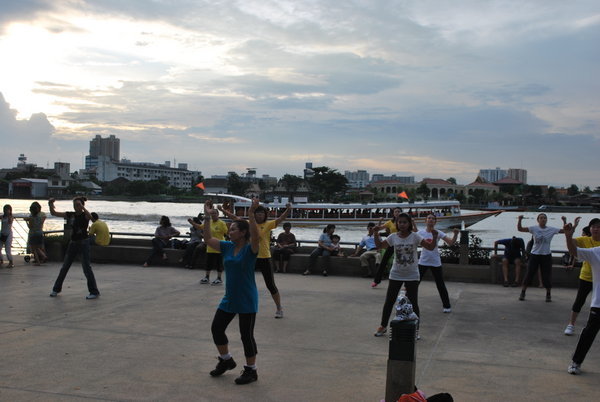 Aerobics at sunset in the park, Bangkok