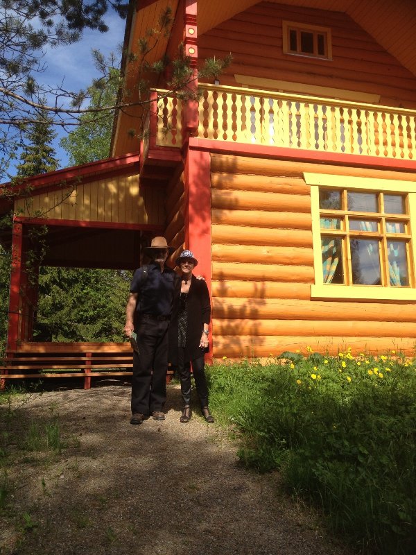 CS & PP outside a holiday cabin