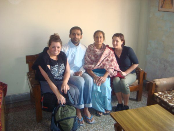 at Kulwant's house with his wife and son