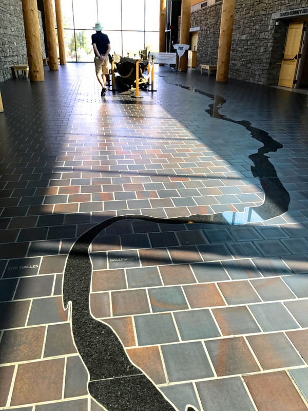Curving black marble inlay represents the Columbia River