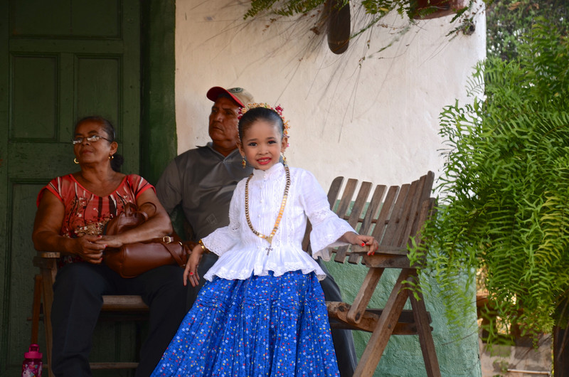Proud family on the farmhouse porch with their beautiful performer