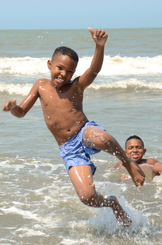 Local children enjoy the beach at La Boquilla