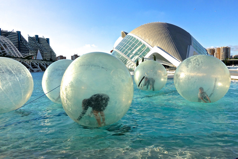 Children float in bubbles at the Museum of Arts and Sciences Valencia, Spain 