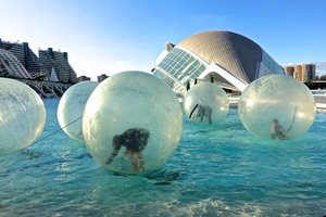 Children float in bubbles at the Museum of Arts and Sciences Valencia, Spain 