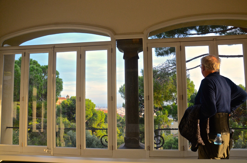 Dave looks at the view out the large window at Gaudi's house