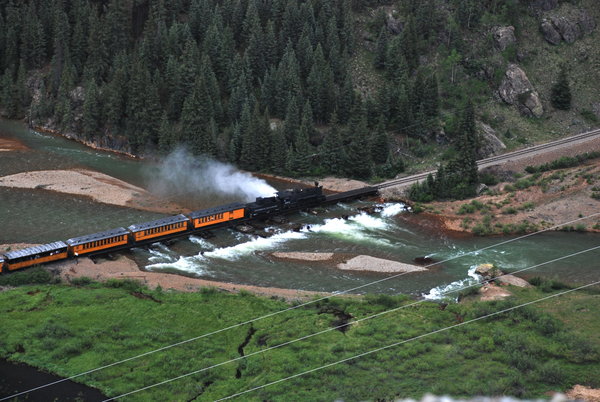 Watching our train weave its way through the mountains as we ride back high above on a bus