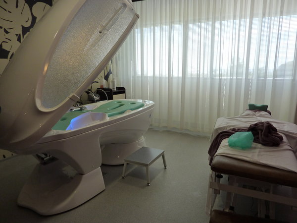The super charged health capsule on left, massage table on right