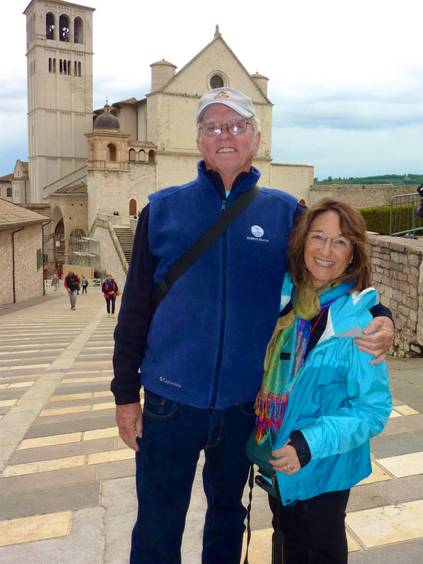 My husband Dave and I are standing in front of the Basilica of St Francis, Assisi, Umbria, Italy 