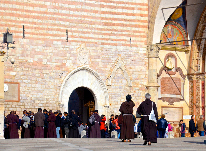 Monks entering the Basilica of St Francis, Assisi, Umbria, Italy 