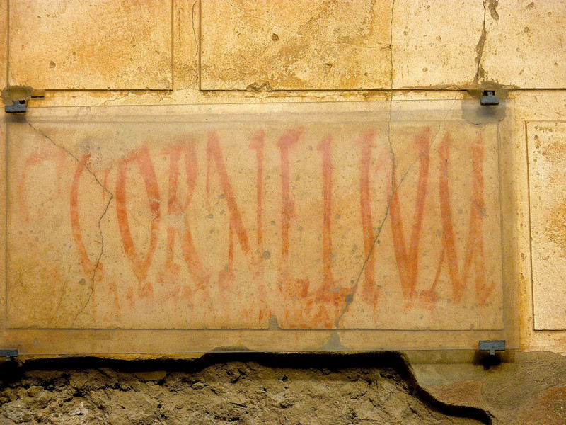 Graffiti on the street advertising her 'business' in Pompeii