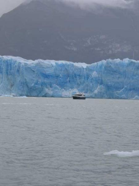 A boat in front of the glacier