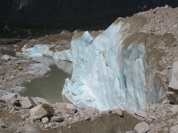 Edge of glaciar next to river