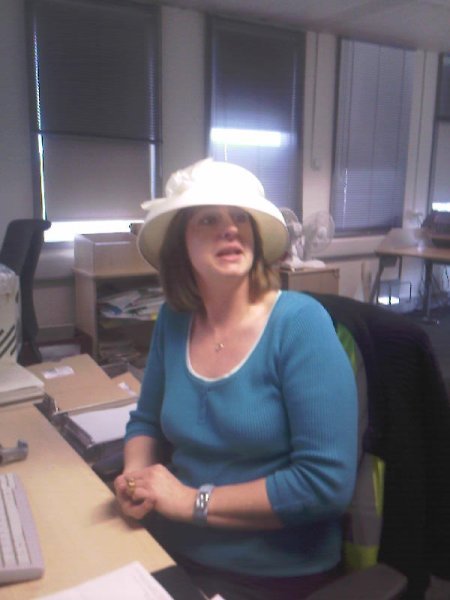 Gail in her wedding hat at work