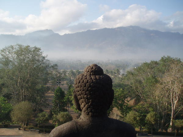 Buddha surrounded by Mountains..