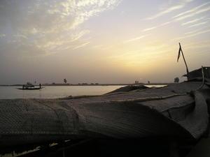 Boat husks at dusk, Mopti