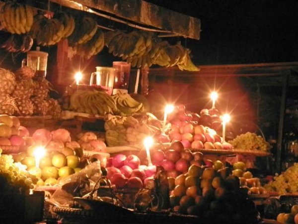 Fruit stand at candle light