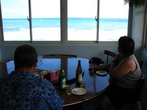 Mom and Dad having lunch beers on the coast