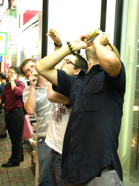 Shotgunning Beers on the posh streets of Hong Kong Island