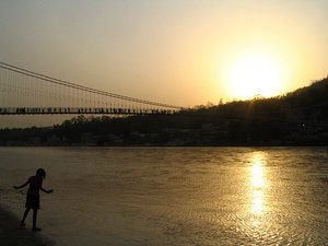 Stream of Pilgrims over the Ganges River, Rishikesh, India  