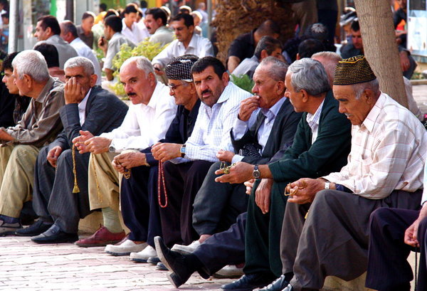 Men playing with their beads in the park, Sulaymaniyah