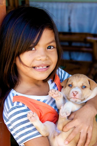 Girl with her puppy