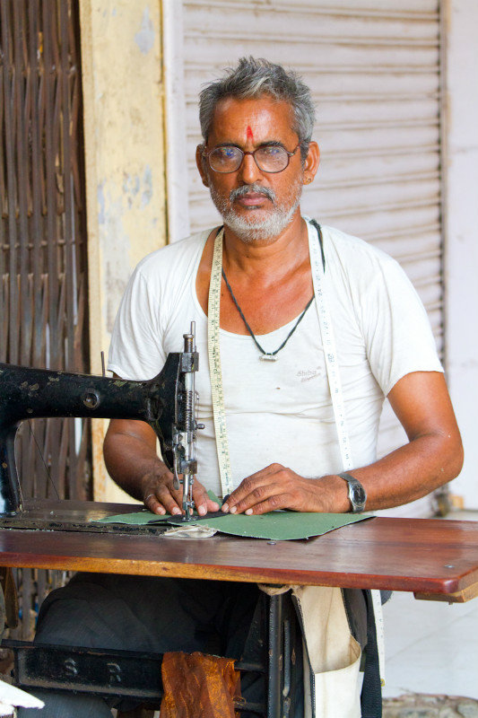 Man at sewing machine