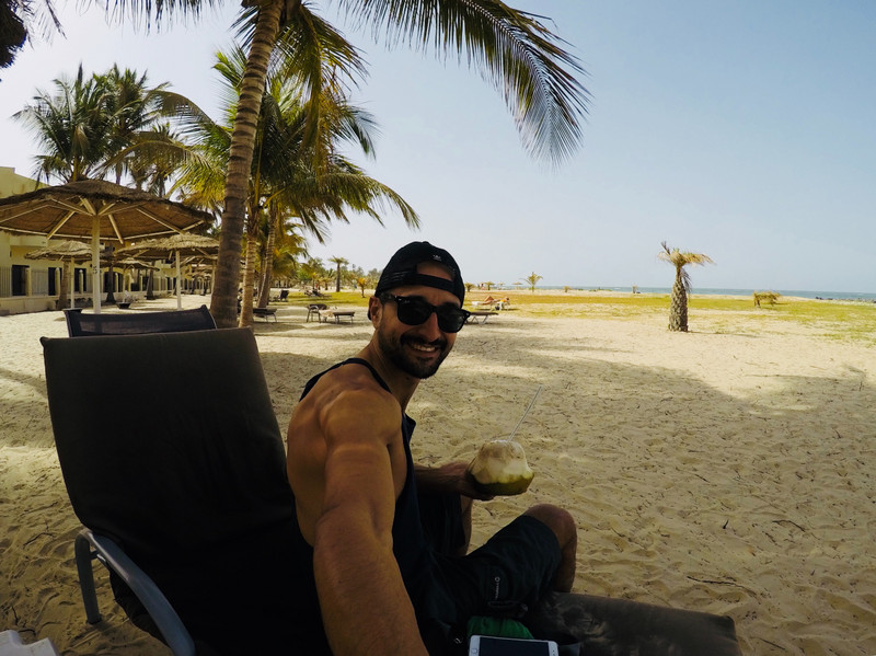 Chilling on The Gambia coast with a coconut 