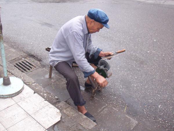 On the streets of Guilin, this kindly man will sharpen anything, and only by hand.