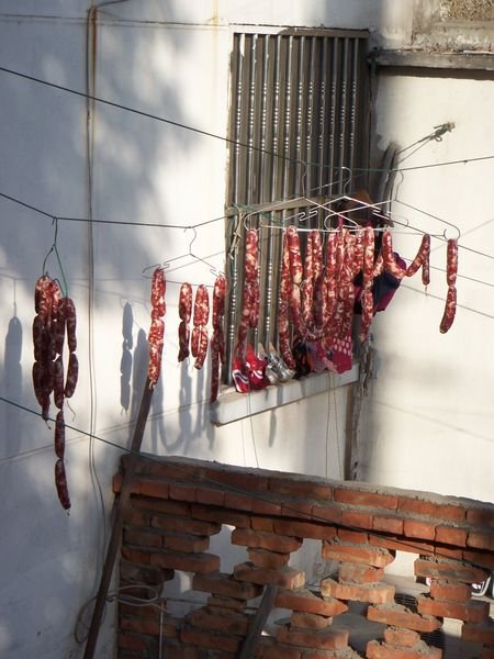 The New Year sausages are drying in the winter sun.