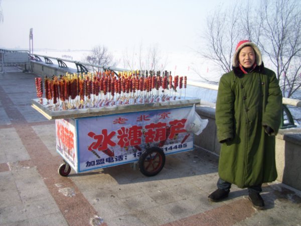 Sugar-glazed fruits for sale everywhere in Harbin