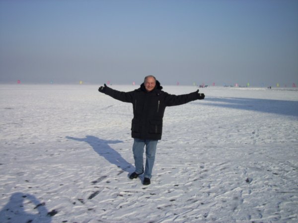 I am standing in the middle of the frozen Songhua River in Harbin