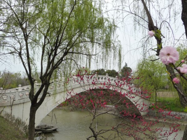 A marble moon bridge leads into the gardens of Mei LanFang.
