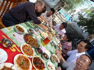 Photo 9: OUTDOOR UIGHUR LUNCH BEFORE OUR JOURNEY INTO THE MOUNTAINS TOWARD THE SYRAM HU LAKE.