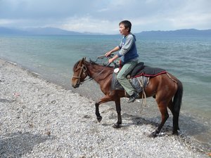 THE LAKE, PHOTO 4: LOCAL HERDERS INVITE US HORSE-BACK RIDING, FOR A SMALL FEE.