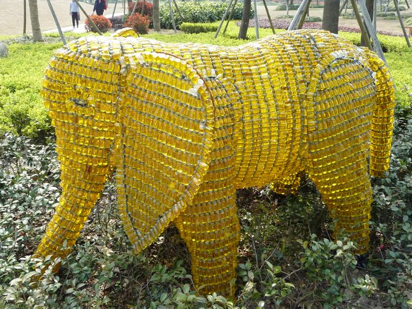 Tiny yellow-glass bottles create this lovely Elephant.