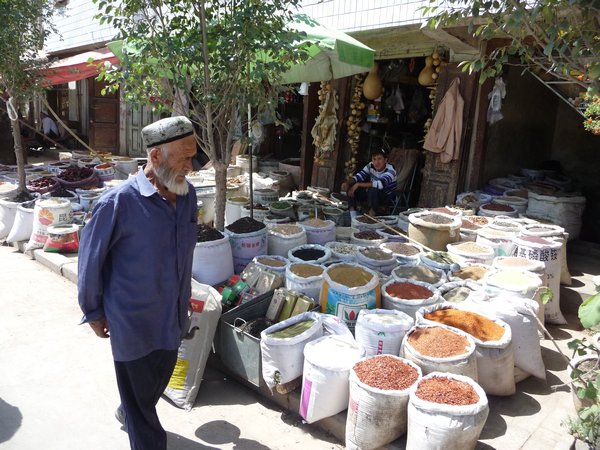 KASHGAR, PHOTO 10: A local inspects the ingredients for a "spicy" meal.