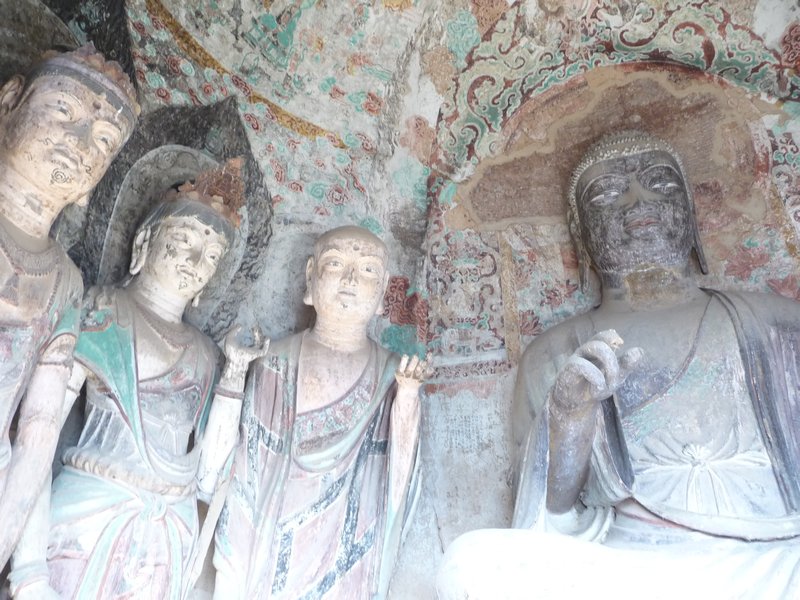 Most of the murals of Maiji Shan have been lost.  In this grottoe, the figures are surrounded by murals that inform of the life of the years past. 