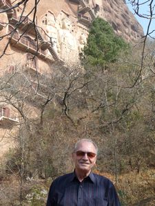 Now take a closer look at the 16 meter tall seated Buddha and his 13 meter tall attending Bodhisattvas behind me.