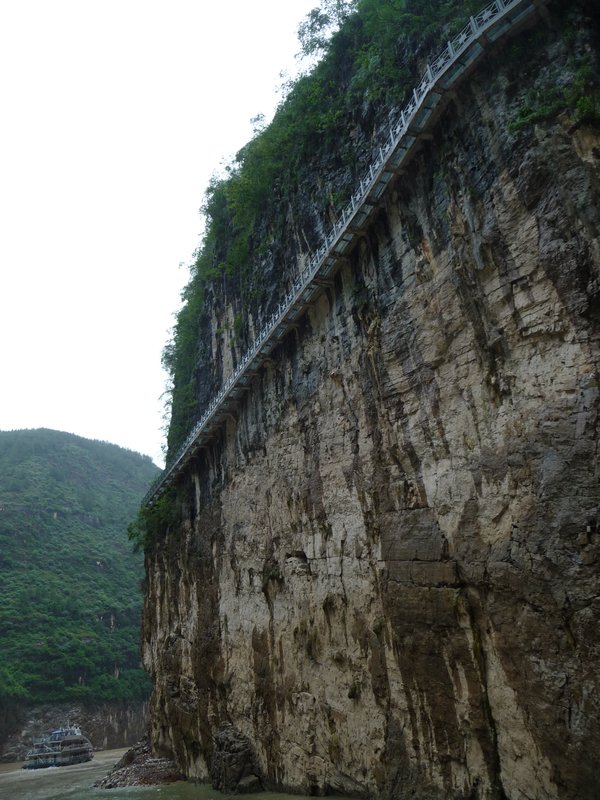 Ancient walk-ways are reconstructed into the mountain cliffs, its planks made of glass.