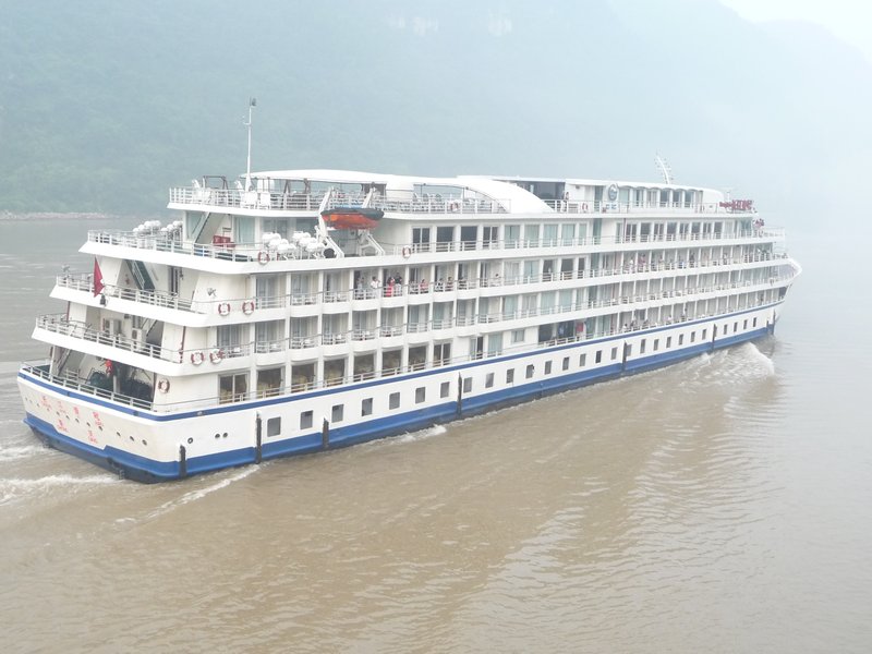 As other cruise ships pass our embarkation point, we too begin to journey along the foggy Yangtzi River.