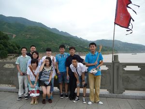 Some of the crew members and waiters of the Century Diamond pose on the bridge to the White Emperor Palace.